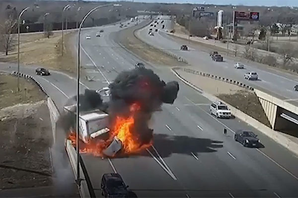 Box truck bursts into flames after being hit by car